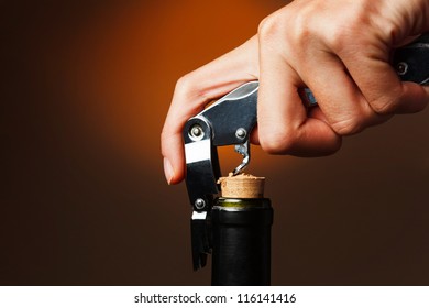 Opening Of Bottle Of Wine With Corkscrew