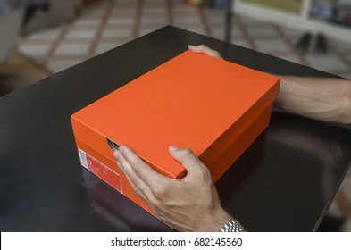 Opening The Box Of A New Pair Of Shoes