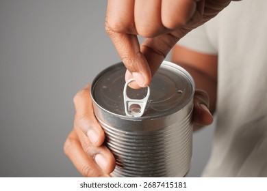 Opening a can with a pull tab for easy access