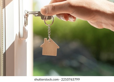 Opening A Door To House With Key. Closeup Of A Hand Open A Lock With Key In Keyhole. Landlord Unlocks The House Key For New Home. Real State, Security Home, Robbery, Alarm. Copyspace Horizontal Banner