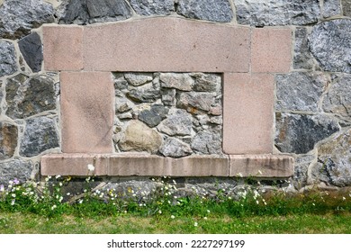 Opening In Historic Stone Wall Closed Up With Stone Masonry Work
