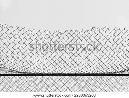 Similar – boy leaning on fence