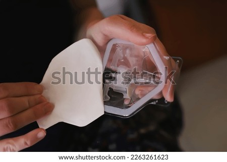 Opening the packaging of the blood glucose sensor