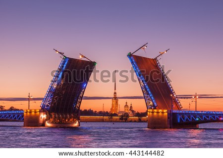 Opening of Palace drawbridge, White nights in Saint Petersburg, view of Peter and Paul Cathedral through the bridge