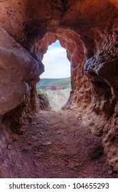 Opening In A Red Rock Cliff Face In Sedona, Arizona