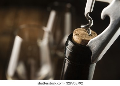 Opening Wine Bottle With A Corkscrew