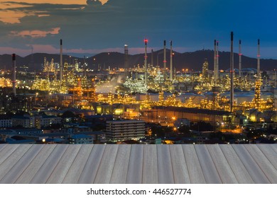 Opening Wooden Floor, Aerial View, Oil Refinery Lights At Twilight,mountain Background