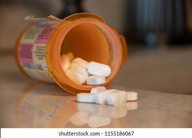 An Open/Spilled Prescription Bottle Of Oxycodone Tablets