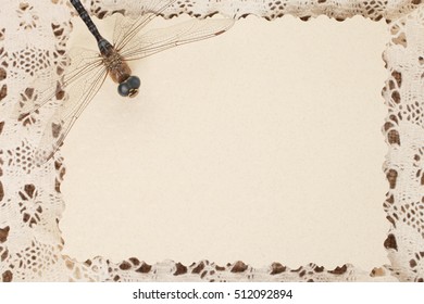 Openwork  frame with a dragonfly