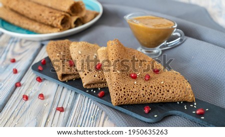 Openwork pancakes. Table setting with pancakes