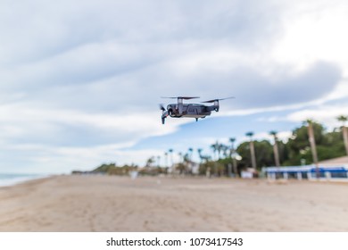 Operating drone at seashore in Spain