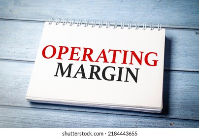 operating margin word on notepad and blue wooden background - Shutterstock ID 2184443655
