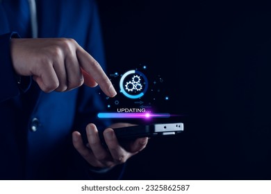 Operating system upgrade concept, installation app and software update process, modernize user equipment, update modern functions, developer released new version Improved security. User is downloading - Powered by Shutterstock