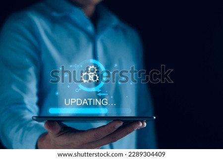 Operating system upgrade concept, installation app and software update process, modernize user equipment, update modern functions, developer released new version Improved security. User is downloading