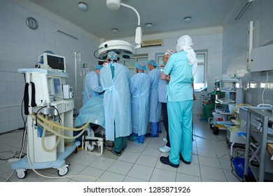 At the operating theatre. Surgeons standing around patient plate and performing an operation. January 12, 2019. Kiev regional clinic 1. Kiev, Ukraine - Shutterstock ID 1285871926