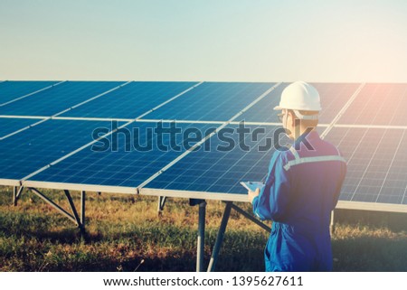 operation and maintenance in solar power plant ; engineering team working on checking and maintenance in solar power plant ,solar power plant to innovation of green energy for life
