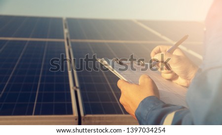 operation and maintenance in solar power plant ; engineering team working on checking and maintenance in solar power plant ,solar power plant to innovation of green energy for life

