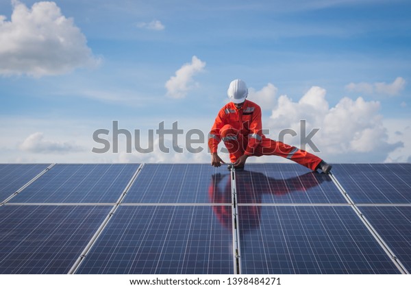 operation and\
maintenance in solar power plant ; engineering team working on\
checking and maintenance in solar power plant ,solar power plant to\
innovation of green energy for\
life\