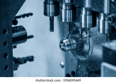 The  operation of multi-tasking CNC lathe machine cutting the fitting part. The hi-technology pipe connector parts by CNC turning machine.