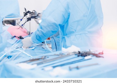 Operation process on abdominal, blue light. Modern laparoscopic equipment, doctor surgery working, sunlight. - Powered by Shutterstock