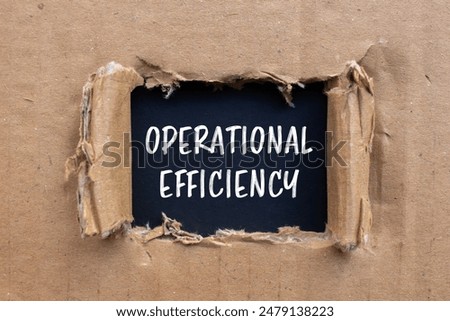 Operational efficiency message written on ripped cardboard paper with black background. Conceptual operational efficiency symbol. Copy space.