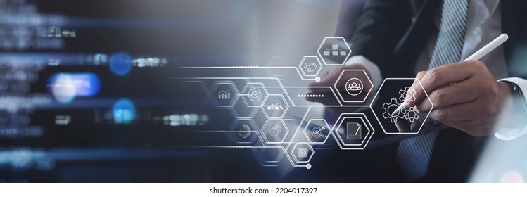 Operations management concept. Businessman on digital tablet with virtual innovation Operations management, business process and problem solving, monitoring and innovation, quality control - Shutterstock ID 2204017397