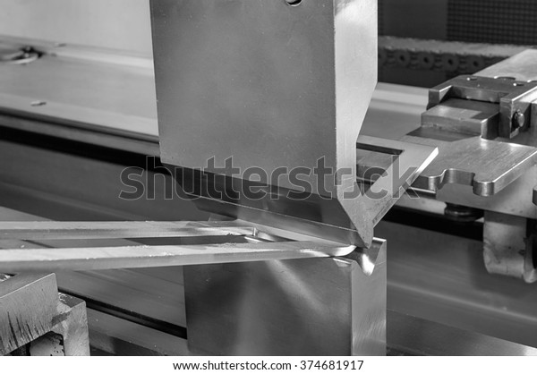 operator\
bending metal sheet by sheet bending\
machine