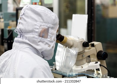 Operator in factory use microscope
