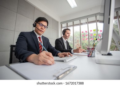 operator with hands-free headset working in the office