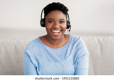 Operator Of Hot Line. Portrait Of Cheerful Female African American Customer Service Representative Wearing Headset In Call Center, Looking At Camera And Smiling. Support, Contact Us