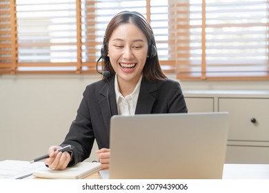 Operator, Smile Asian Young Woman Wearing Headset, Headphones And Speaking On Video Call Conference With Customer, Colleagues Support Phone, Work On Laptop Computer
Technology Of Help, Consult Service