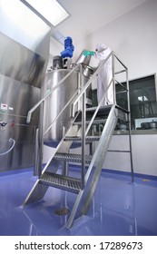 An Operator Working In Manufacturing Facility In Pharmaceutical Factory