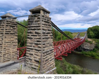 The Ophir Suspension Bridge Is A Classic One-way Red Bridge Built During The Central Otago Gold Rush, South Island, New Zealand