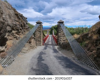 The Ophir Suspension Bridge Is A Classic One-way Red Bridge Built During The Central Otago Gold Rush, South Island, New Zealand