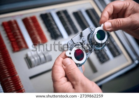Ophthalmologist preparing optical instruments, close up