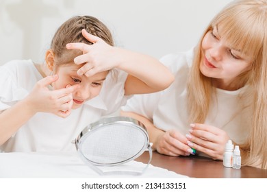 the ophthalmologist shows and explains to the girl how to use night treatment contact lenses. Advertising contact lenses for vision. Ophthalmology, optical store, health care and medicine.