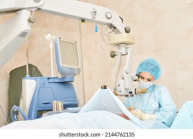 Ophthalmology Laser Microscope Operation. Doctor Surgery In Clinic. Patient Eye Treatment. Myopia And Cataract Removal. Medical Vision Prp Lasik