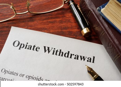 Opiate Withdrawal Written On A Paper. Drugs Addiction Concept.