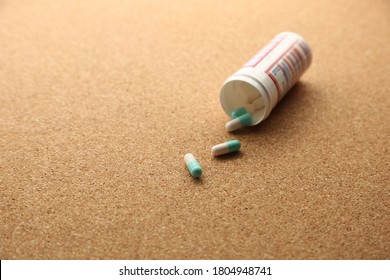 Opioid Drugs On A Wooden Table Top. This Image Can Be Used To Represent Drug Addiction. 