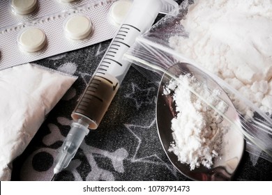 Opioid epidemic .Opioid Pills. Drug abuse Concept. Syringe preparation spoon and prepared the heroin. Stop the use of drugs.