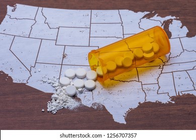 Opioid and prescription drug epidemic concept in United States with pills and bottle and room for copy text