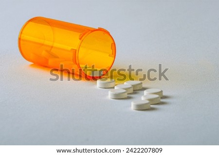 Opioid tablets on white  background without text,  conceptual image,   ample copy space.