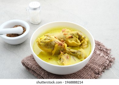 Opor Ayam, Indonesian traditional  food served in white bowl, made from chicken cooked with coconut milk and spices. Its served to celebrate Eid Adha and Eid Fitr. 
