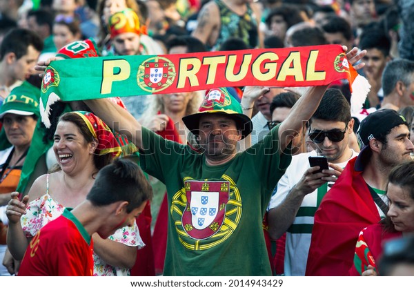 OPORTO, PORTUGAL - JUL 10, 2016: During video translation of the football match Portugal - France final of the European championship 2016, Portuguese fans in the Porto city center. 