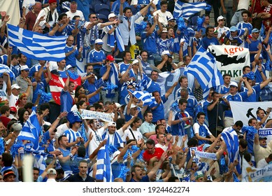 Oporto, PORTUGAL - June12, 2004: 
Colourful Greek Fans
During The UEFA Euro 2004 - 
Portugal V Grece At Estádio Do Dragão. 
