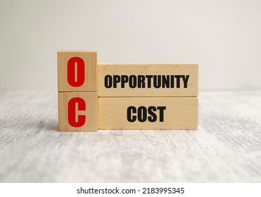 Opportunity Cost Words On Wooden Cubes And White Background