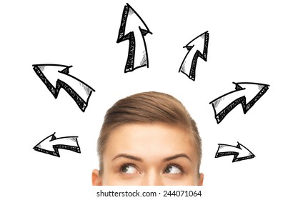 opportunity, solutions and people concept - close up of woman looking up to arrow doodles