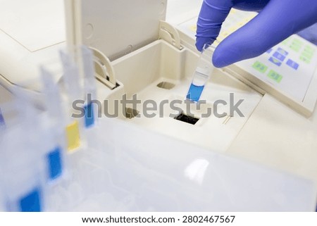 Optical analysis of substances using a spectrophotometer in a laboratory. Determination of optical density.