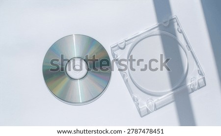 Optical Disc and Clear Case on White Background