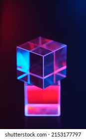 Optical glass objects with multi-colored lighting. Neon background with geometric shapes, soft selective focus. - Shutterstock ID 2153177797